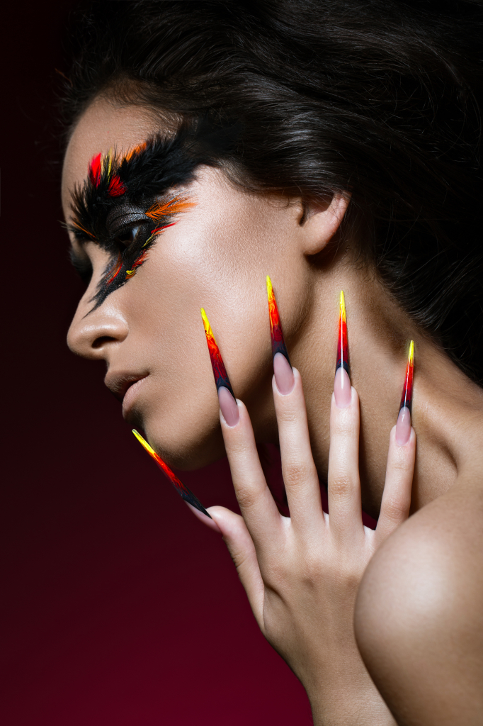 beautiful_girl_in_image_of_phoenix_bird_with_creative_makeup_and.jpg